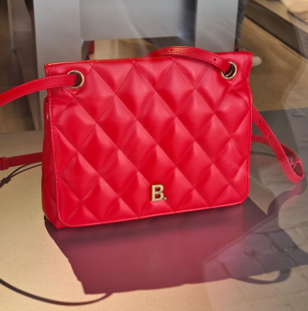 Discount designer bags for AW'20 including a red quilted shoulder bag from Balenciaga.